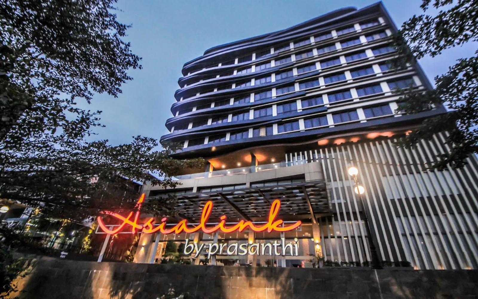 Outdoor Lagoon Pool at Asialink Hotel by Prasanthi