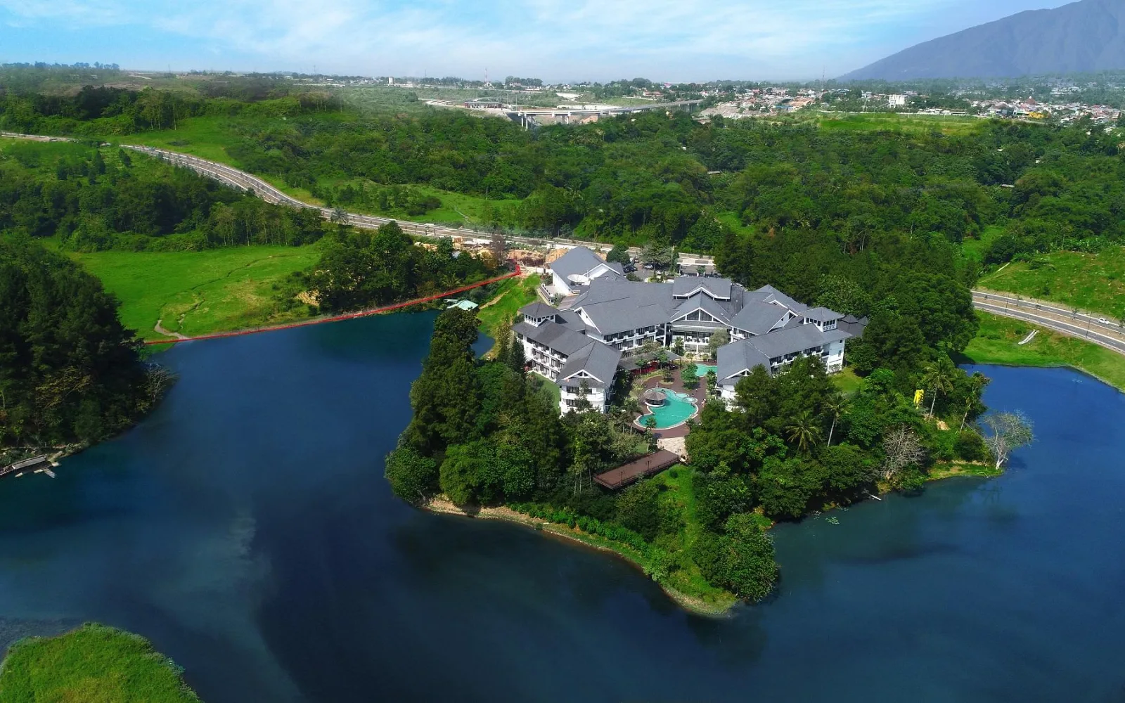 Outdoor Lagoon Pool at Lido Lake Resort by MNC Hotel